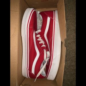 Red Vans Old Skool low tops.